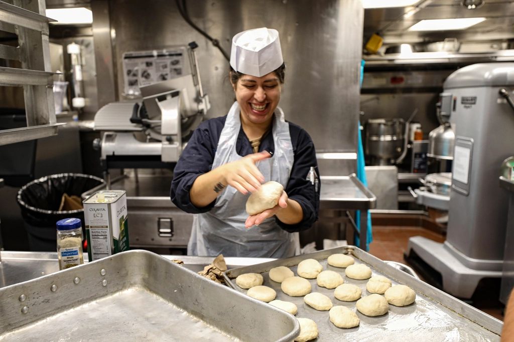 A cook working at the open kitchen