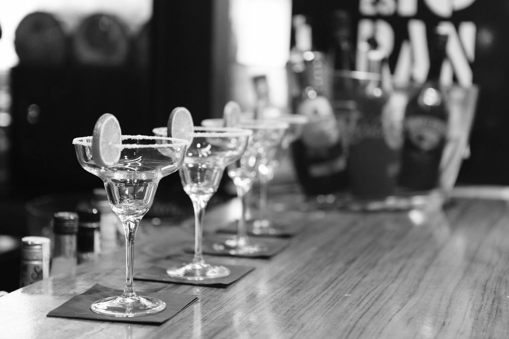 A cocktail being finished at the bar
