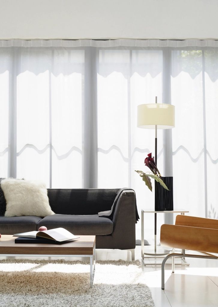 A suite sitting room with a sofa and armchairs